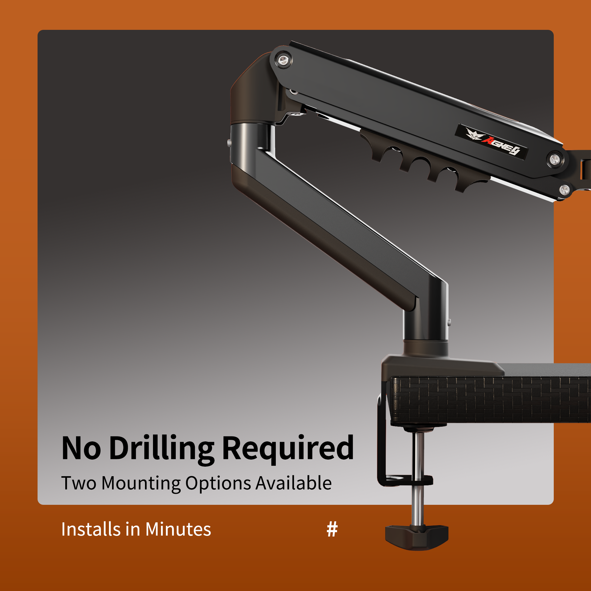 Black M1 monitor arm clamped to desk edge, adjustable pivot joints for ergonomic screen positioning