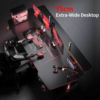 White K2 Dual Motor Standing Desk with carbon fiber textured extra-wide 75cm desktop, dual monitors, and gaming setup.