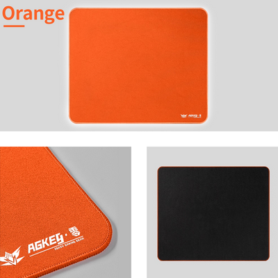 Orange AGKey Zero mouse pad with stitched edges and a black non-slip rubber base.